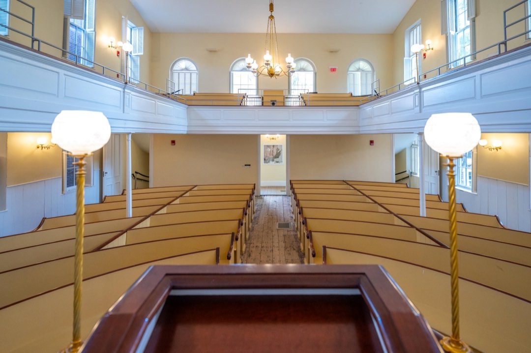 View from the pulpit at the African Meeting House, which has rows of benches and an upper gallery